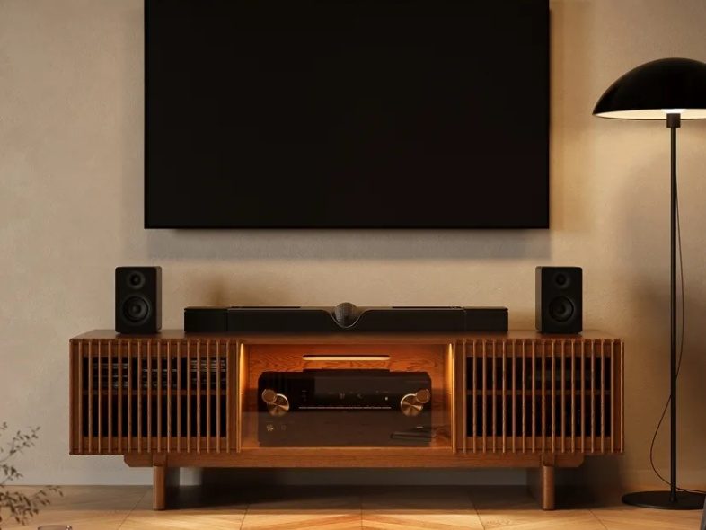 Arboren-71'' Mid-Century Modern TV Stand with storage for media and game console and soundbars on top near a black floor lamp and a wall-mounted tv in a warm living room