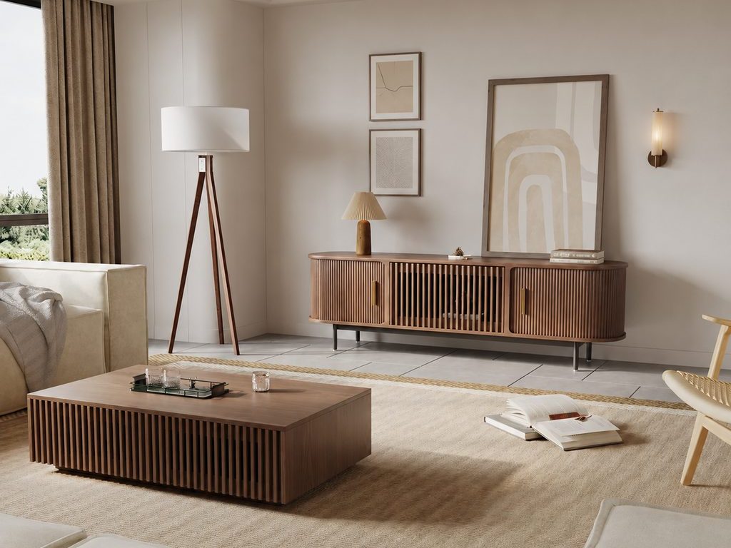Warm neutral living room with a slatted wood sideboard, layered abstract wall art, a wall sconce, and a low wood coffee table.