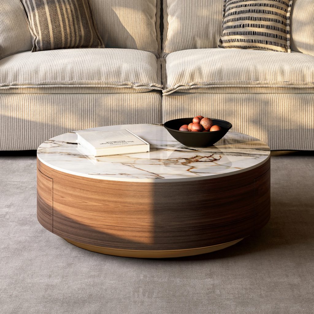 Round drum coffee table with a marble-look sintered stone top and walnut wood base in front of a beige sofa.