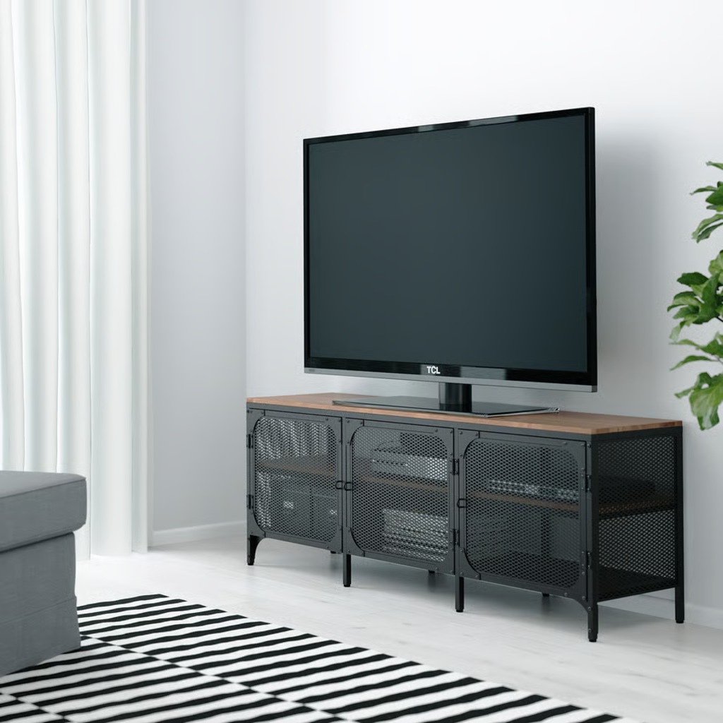 Black metal narrow TV stand with mesh doors, a wood top, and a flat-screen TV in a modern living room.