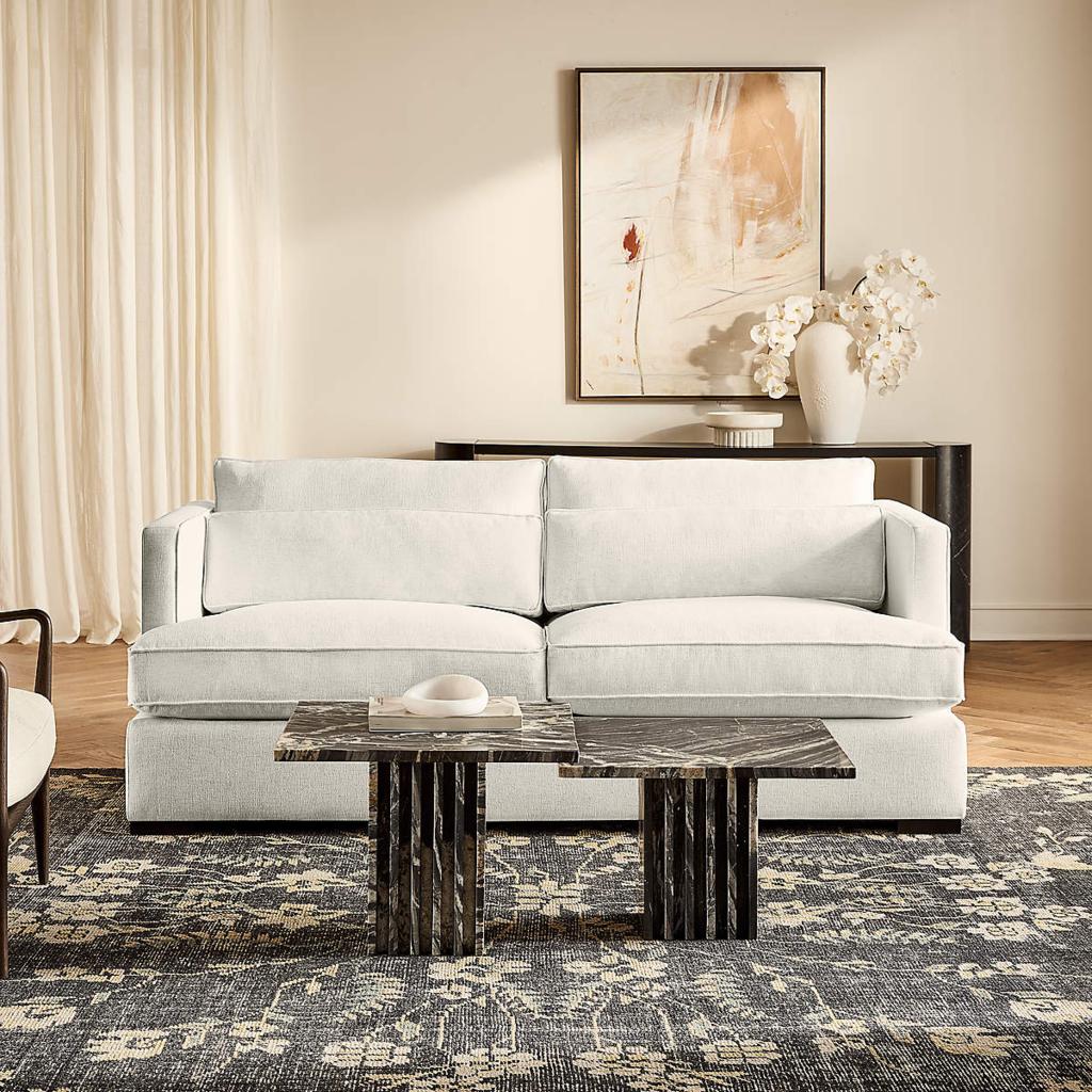 White performance-fabric sofa with loose cushions in a modern family living room