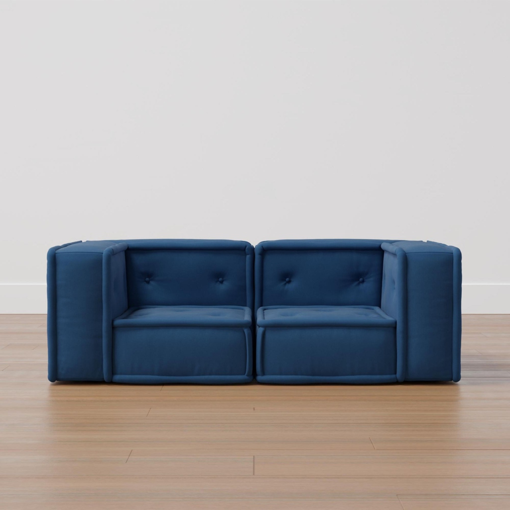Blue modular loveseat with two low-backed seats and wide padded armrests