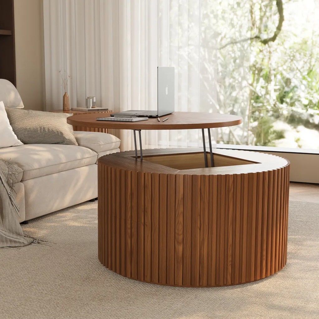 Round fluted wood lift-top coffee table raised for laptop use beside a cream sofa in a bright living room.