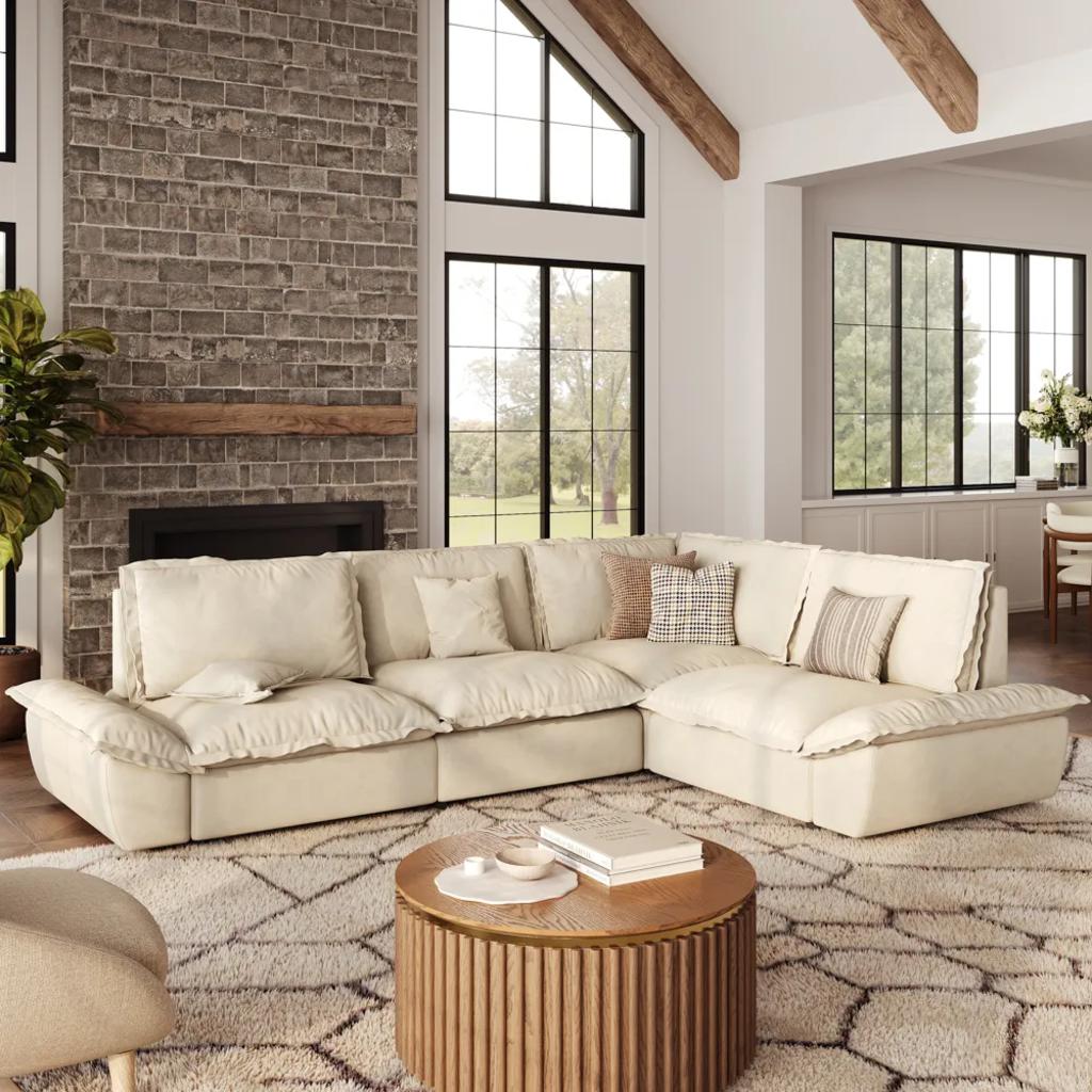 Cream modular sectional sofa with deep cushions in a spacious family living room