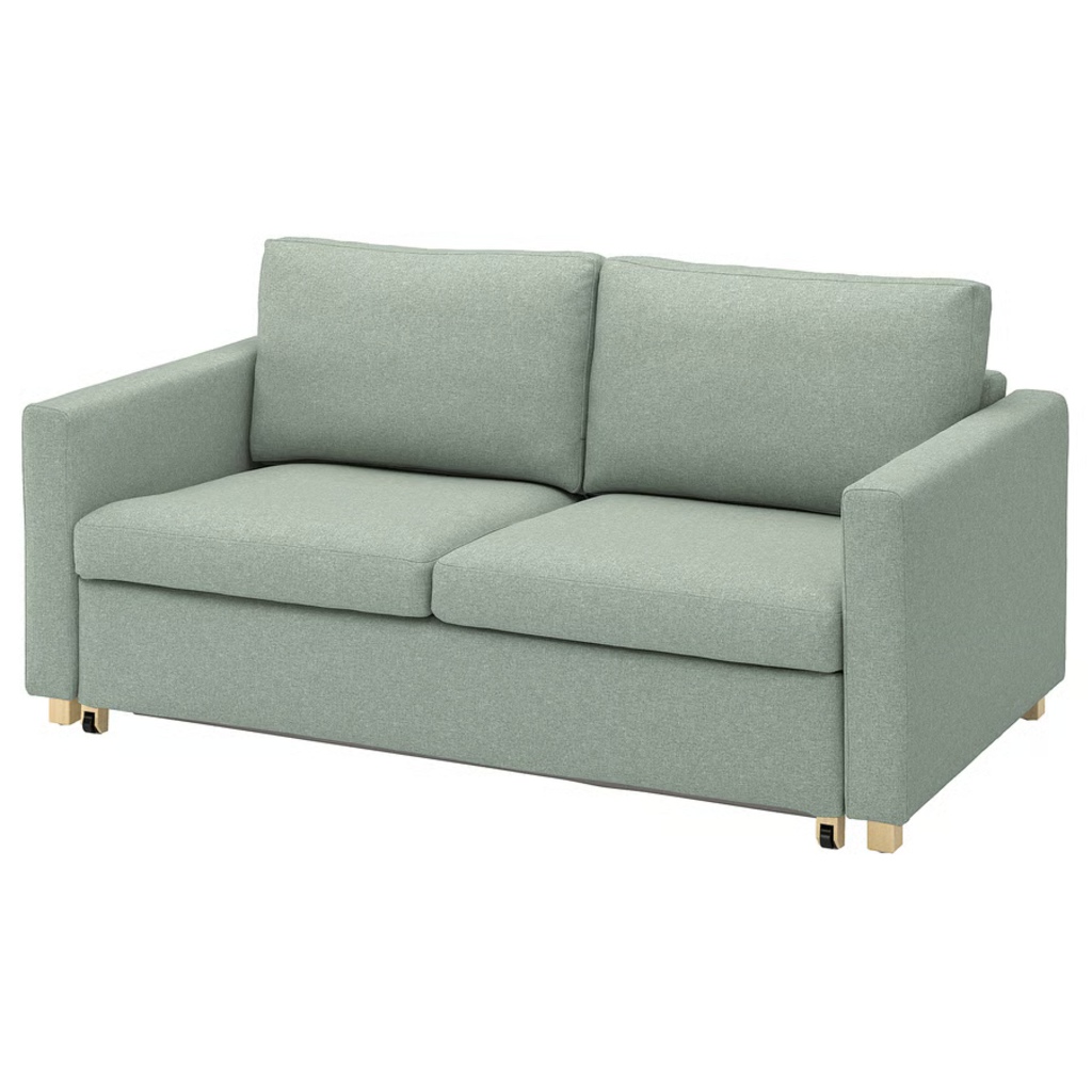 Light green compact sleeper sofa with two seat cushions and slim track arms on a white background