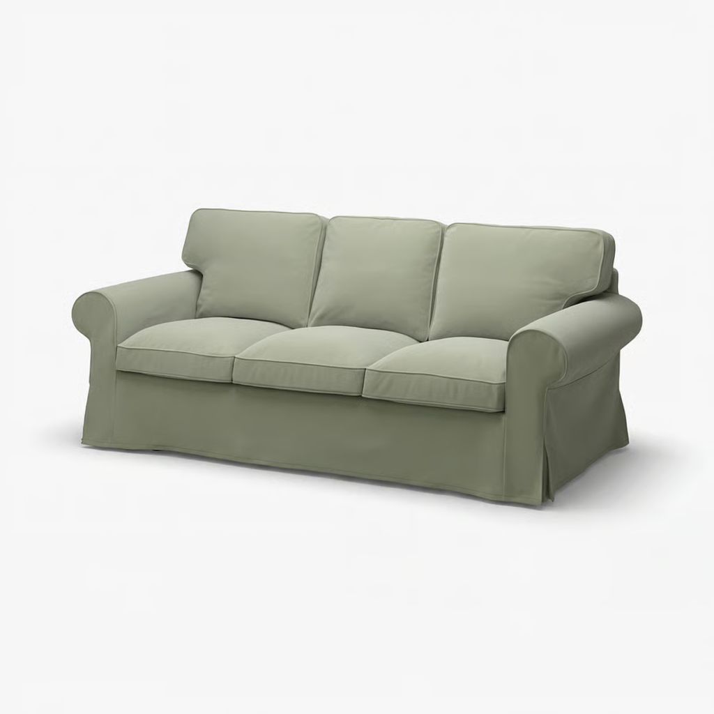 Light green slipcovered sofa with supportive seat and back cushions on a white background.