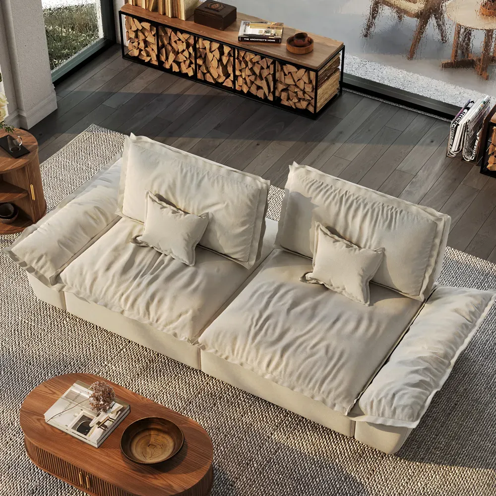 Cream sofa with two deep shared seats, movable back cushions, and wide lounging space for couples to snuggle.