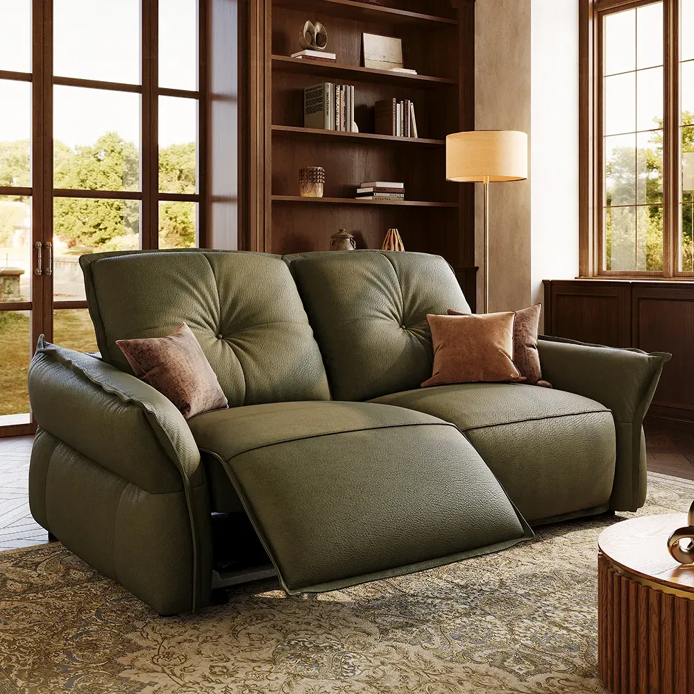 Green power reclining loveseat with wide supportive seats and one extended footrest.