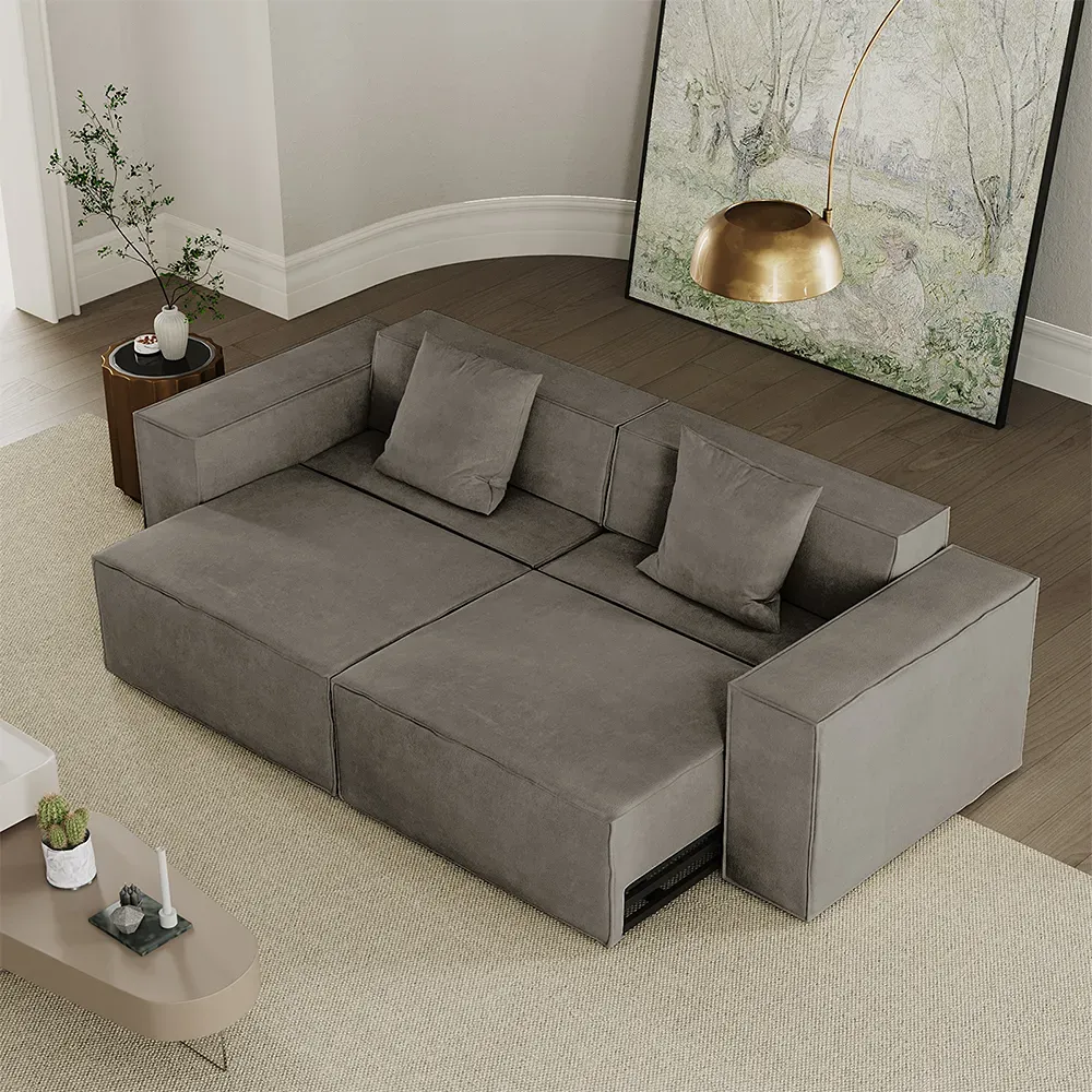 Gray power sofa bed extended into a guest-ready sleeping surface in a modern living room.