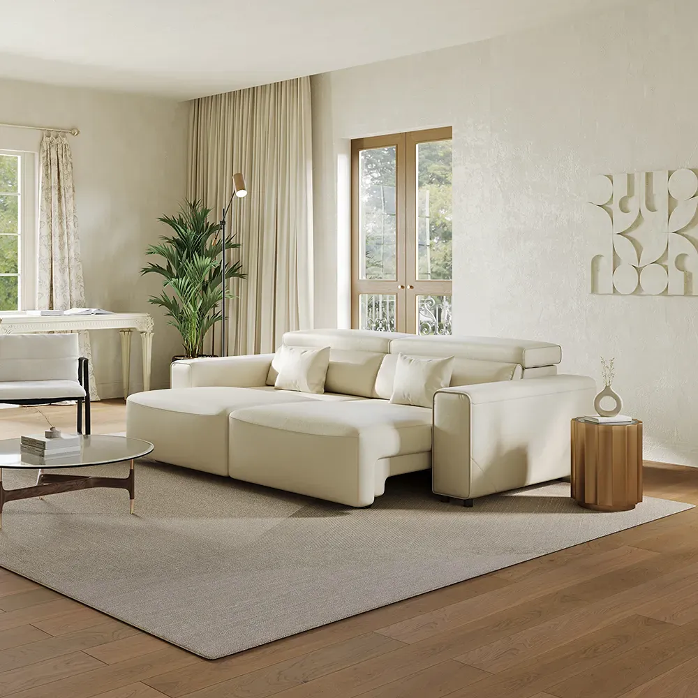 White power sofa bed with an extended seat in a bright apartment living room.