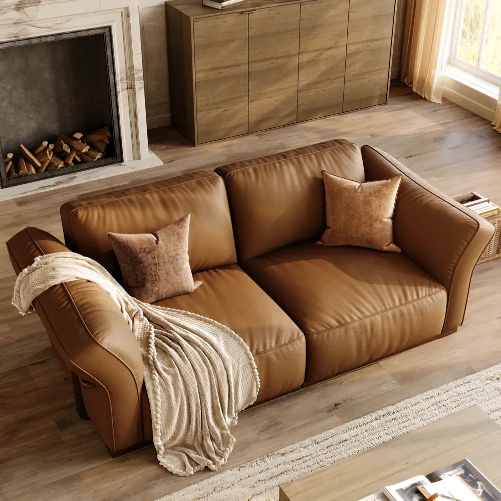 Top view of a deep brown leather sofa with wide cushions and throw pillows.