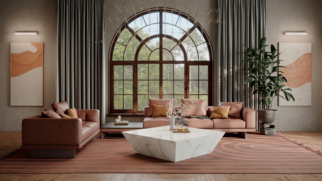 Terracotta sofas surrounding a sculptural white coffee table in a spacious living room with an arched window.