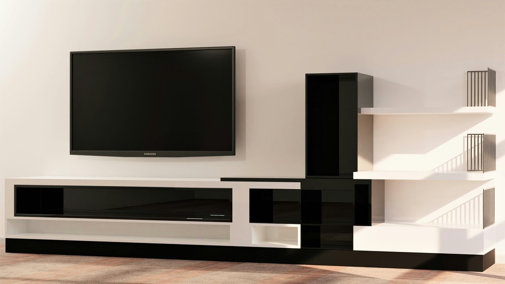 Wall-mounted TV beside a black-and-white entertainment center with open shelves and glossy storage cabinets.