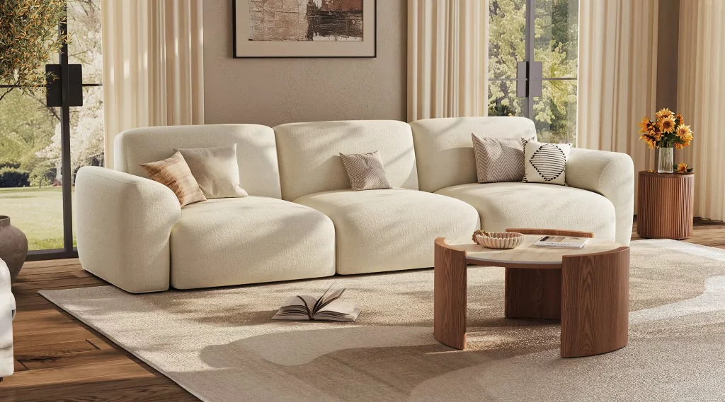 Cozy neutral living room with beige sectional sofa, round coffee table, and warm wood accents