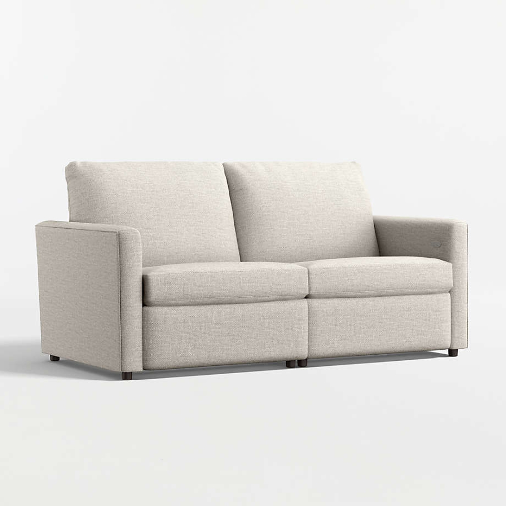 Light beige two-seat reclining sofa on a white studio background.