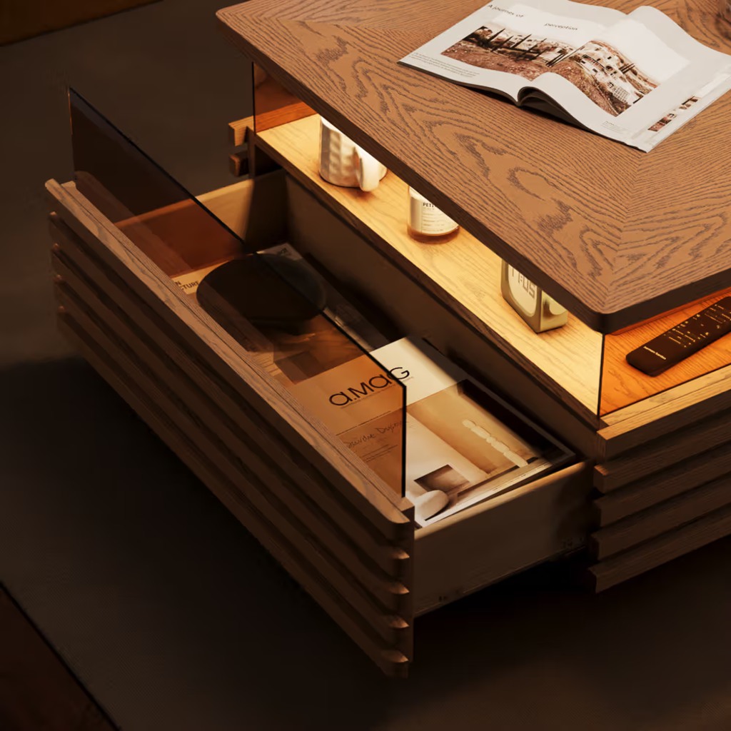 Wood LED coffee table with illuminated open storage, a pull-out drawer, remote control, and magazines on the tabletop.