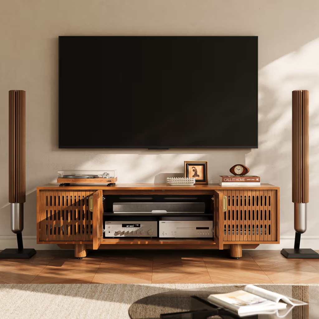 Modern home theater setup with a wall-mounted TV, wooden media console, AV equipment, turntable, speakers, and warm natural lighting.