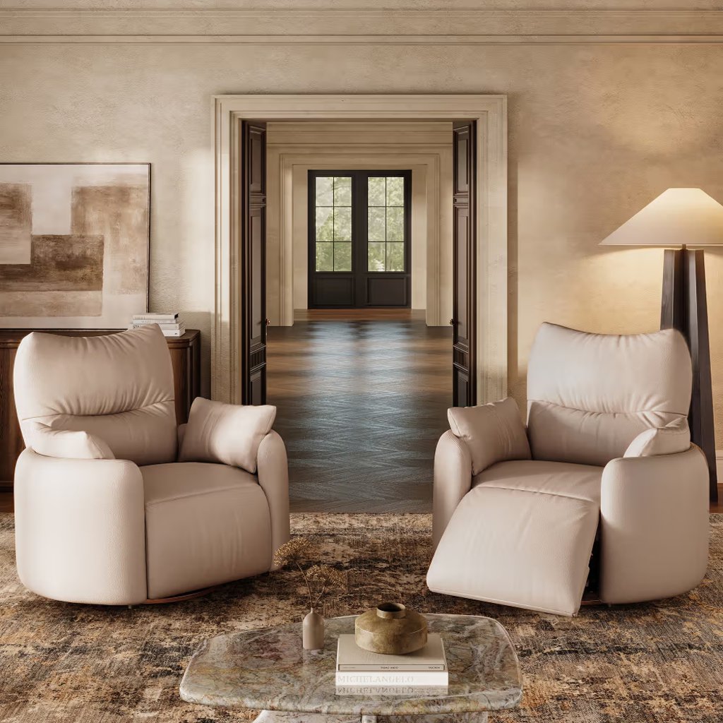 Two cream leather recliner armchairs in a warm modern living room, with one chair upright and the other reclined.