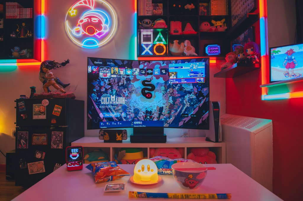 Colorful gaming room with a TV, PS5 console, and open media console shelving.