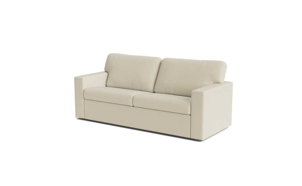 Cream two-seat sofa with boxy arms and loose back cushions on a white background.