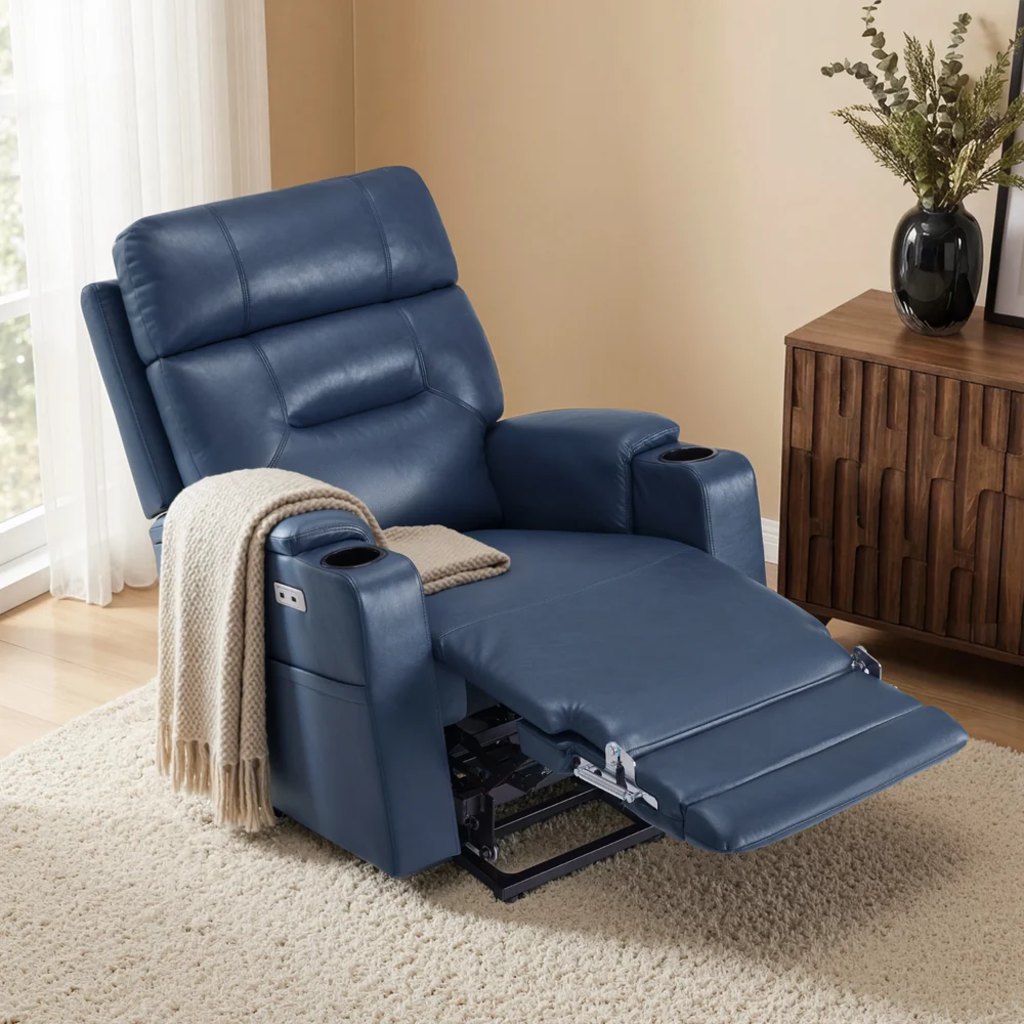 Blue power recliner with extended footrest, cup holders, and charging port in a living room