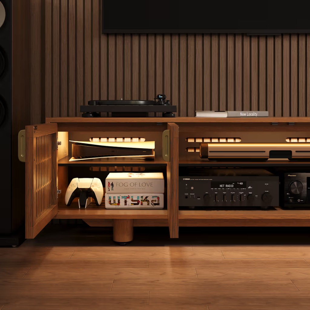 Wood slatted TV stand with open doors displaying a game console, controller, AV receiver, and media equipment.