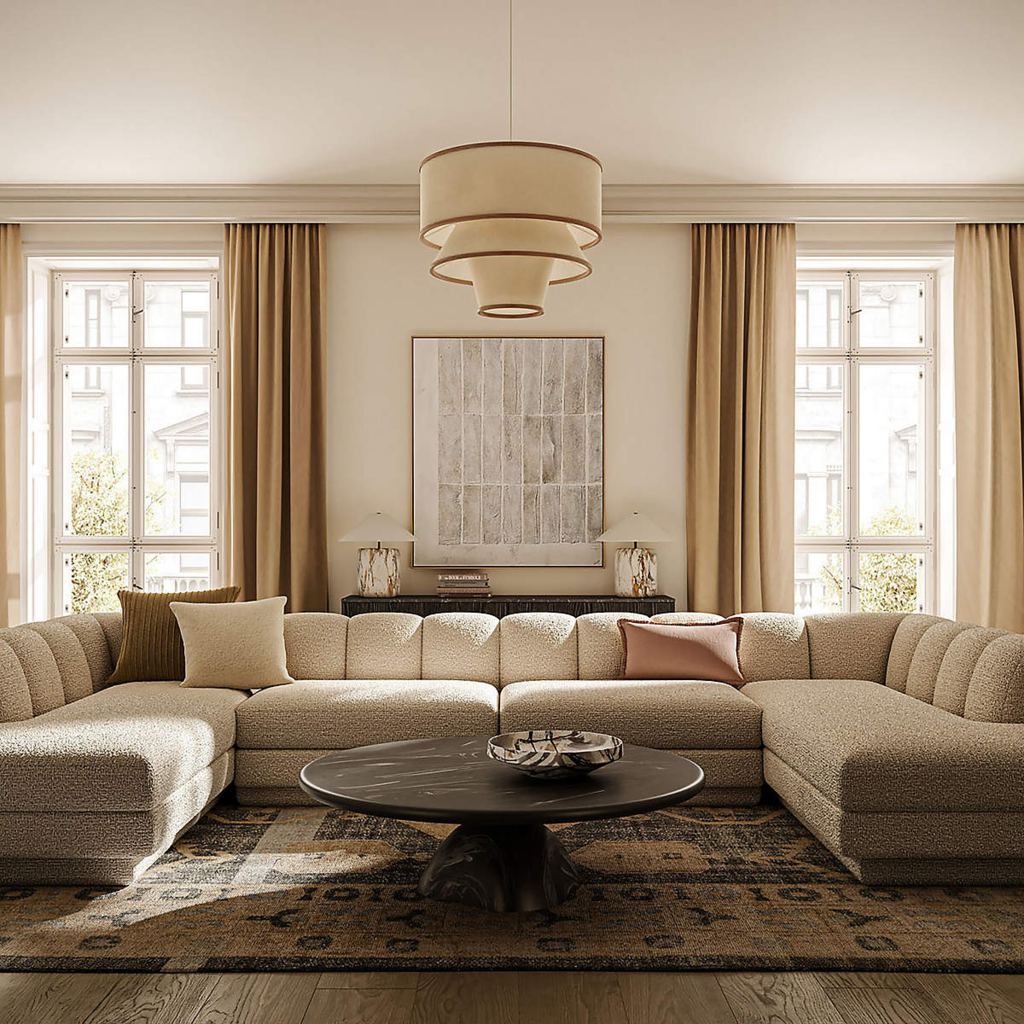Large U-shaped sectional sofa with a round coffee table in a neutral living room.