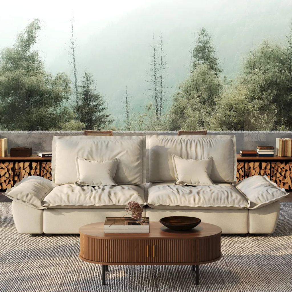 Cream oversized reclining sofa with loose cushions in a modern media room with a forest mural.