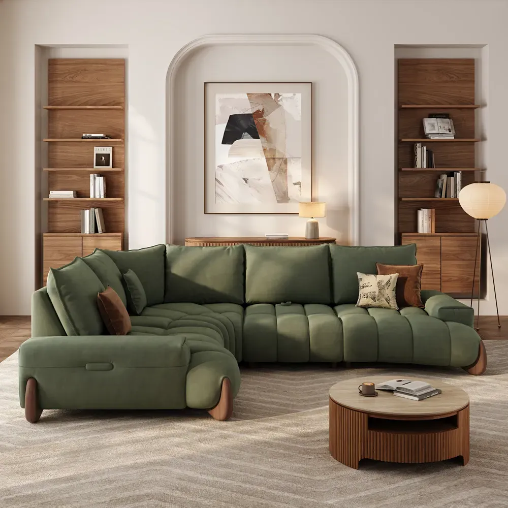 Green L-shaped sectional sofa with deep cushioned seats in a modern living room.