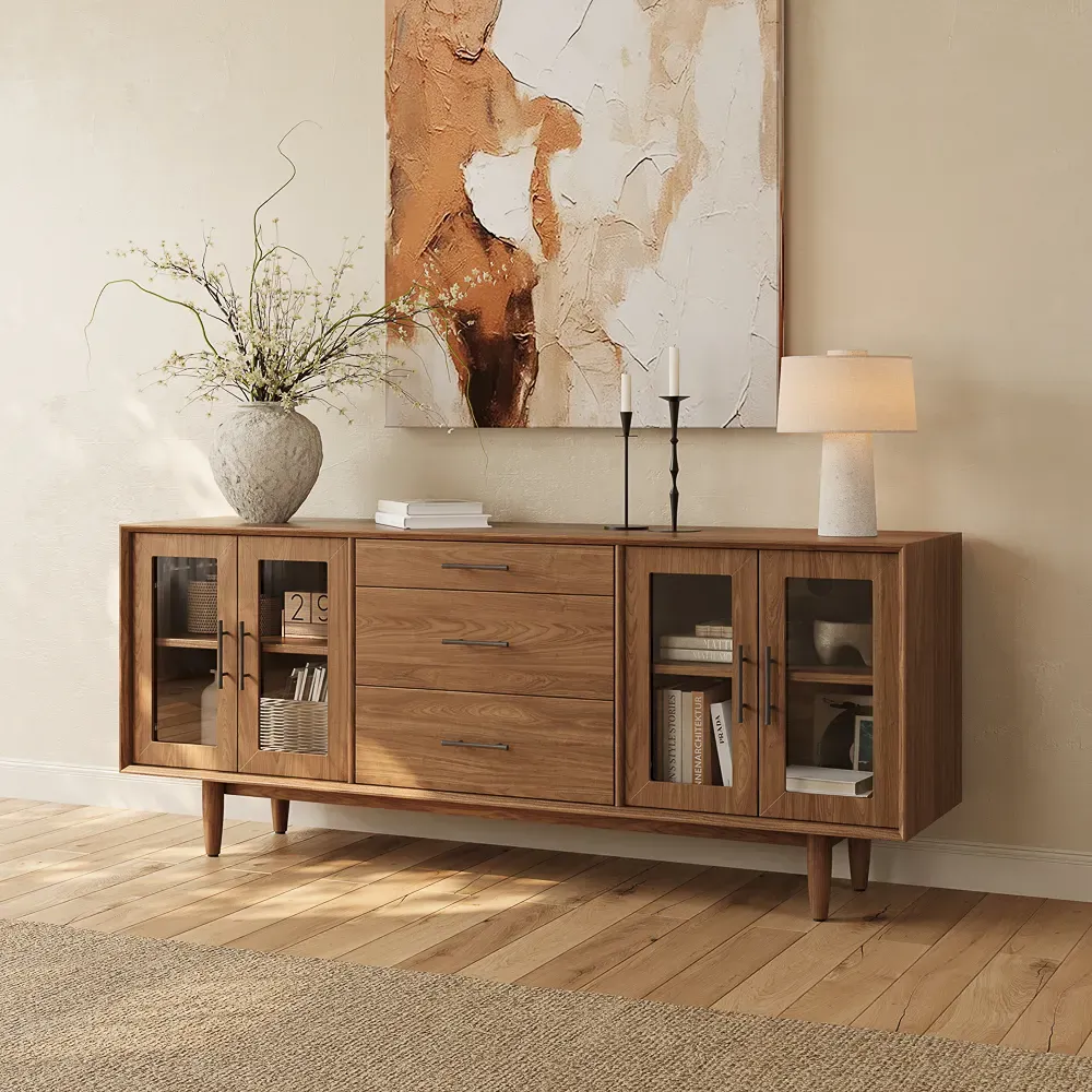 Walnut TV stand with four glass cabinet doors and three center drawers in a warm modern living room.