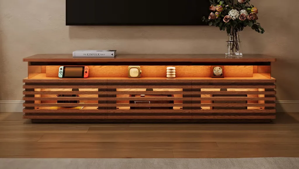 Sturdy wooden media console with a solid low-profile frame, slatted cabinet doors, and built-in storage beneath a wall-mounted TV.