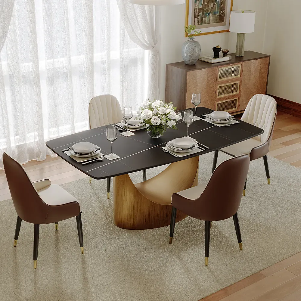 Modern dining room with a rectangular black dining table, six upholstered chairs, tableware, and floral centerpiece.