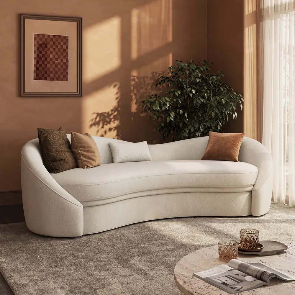 POVISON Cotton Linen Curved Sofa in cream upholstery with neutral pillows in a warm living room.