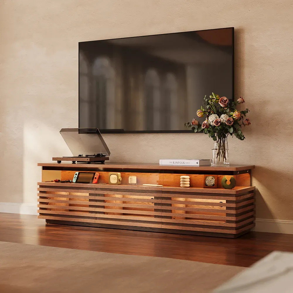 Low slatted media console with a turntable, gaming device, and open display shelf.