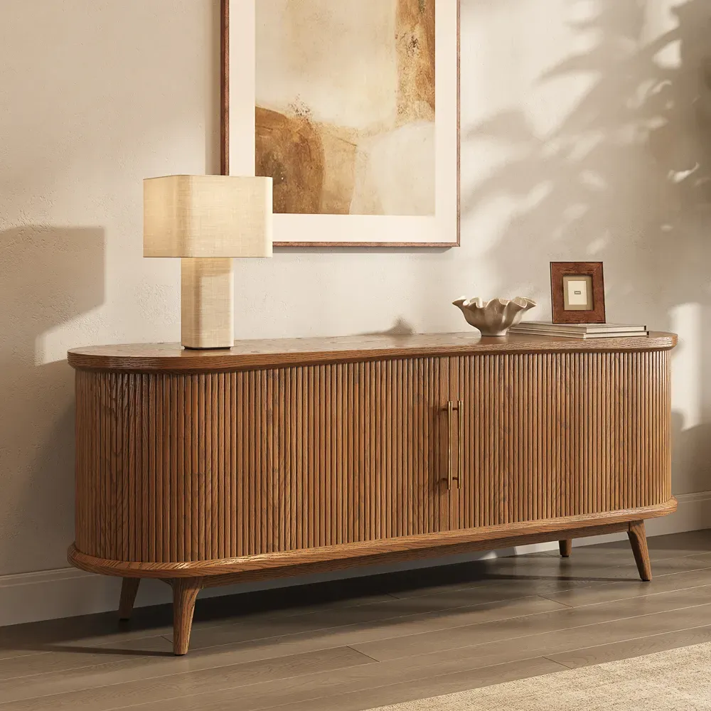 Mid-century walnut media console with closed tambour sliding doors and rounded cabinet ends.