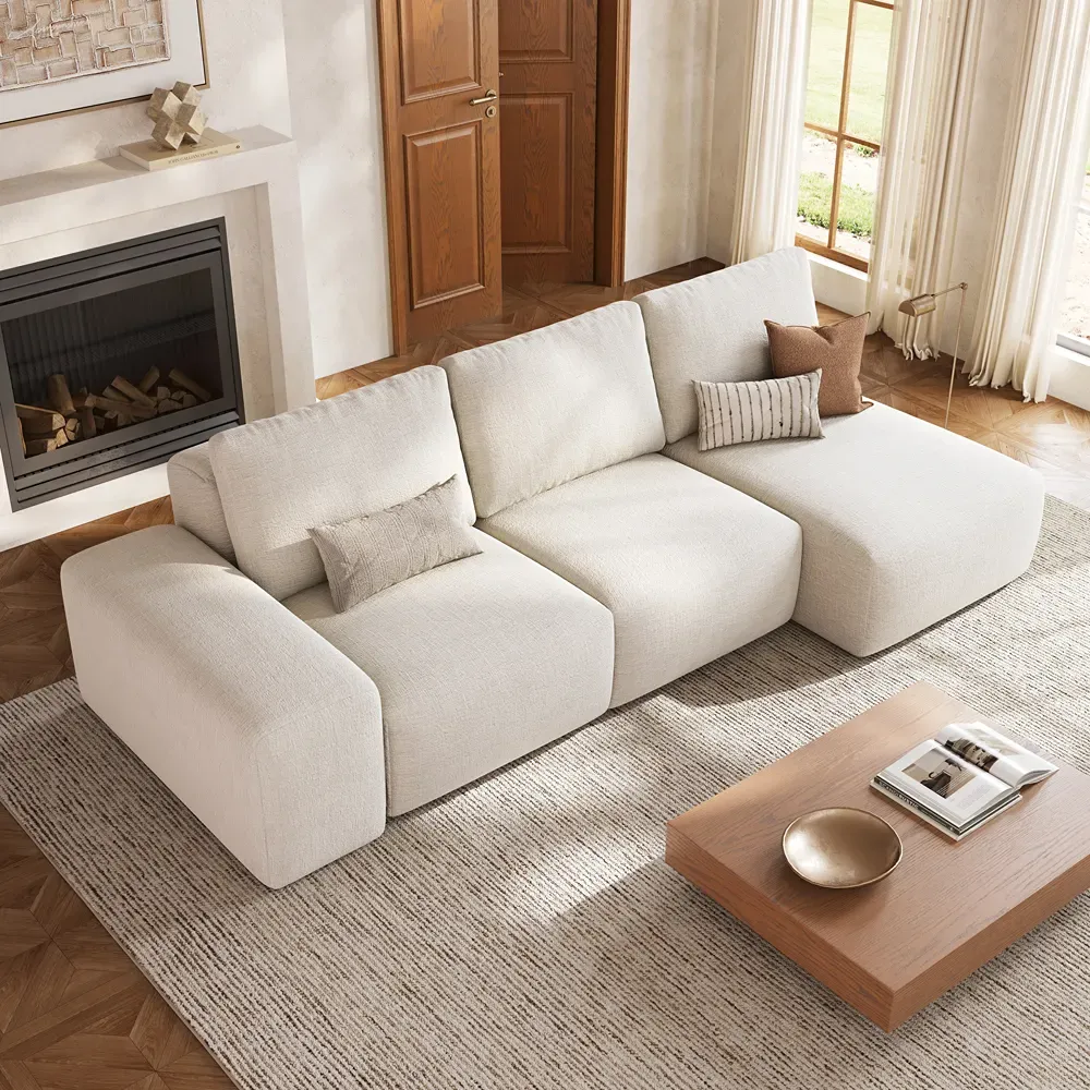 ChatGPT 说:
1. Cream modular sectional sofa with chaise in a bright living room with fireplace and wooden coffee table.