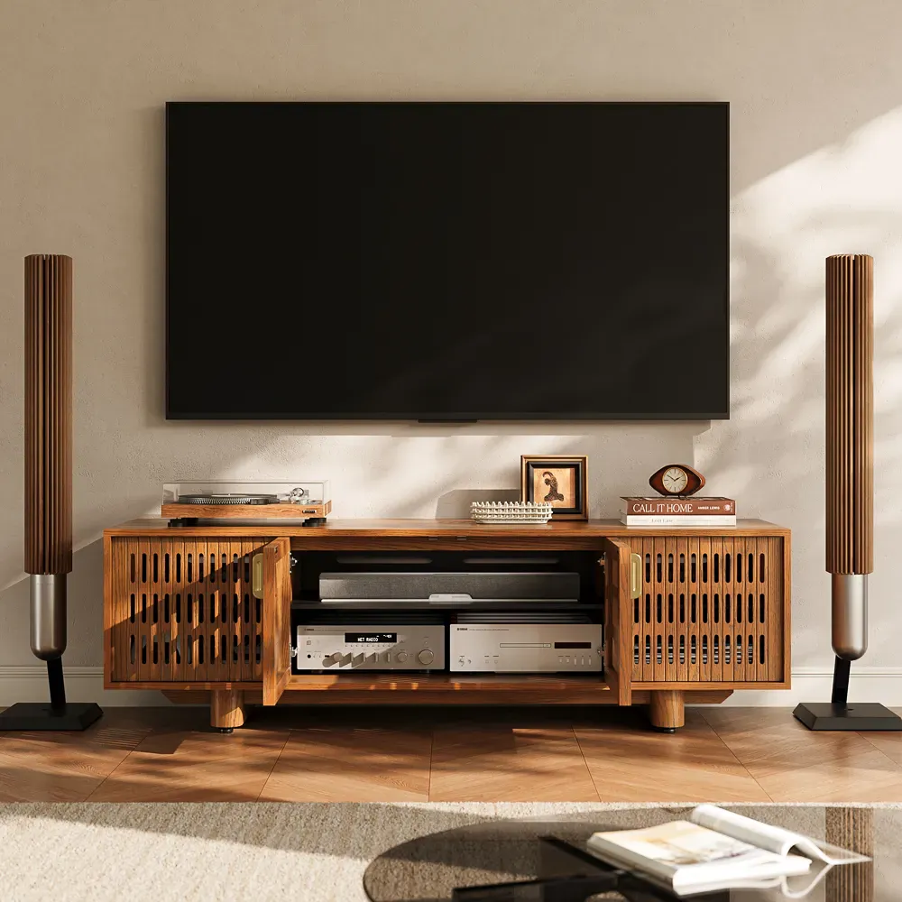 Wood media console with a soundbar, AV receiver, and audio components beneath a wall-mounted TV.