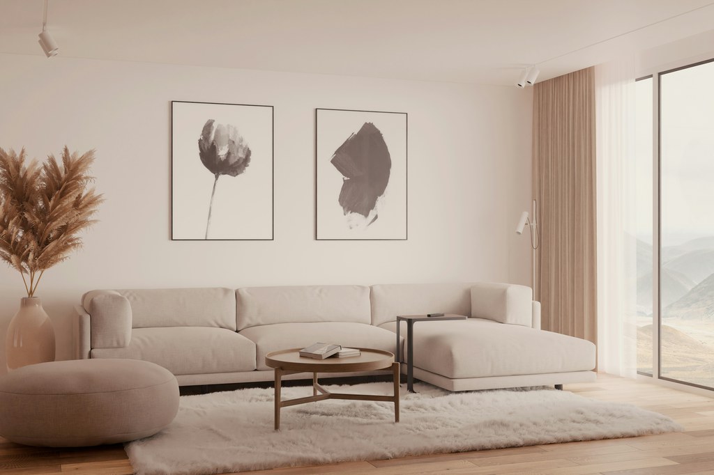 Beige modular sectional sofa on a large area rug in a bright modern living room