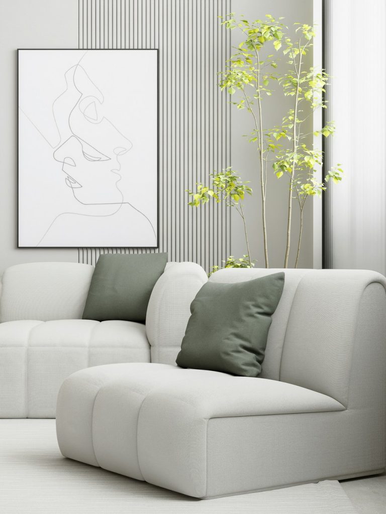 White modular sofa sections with green cushions in a bright modern living room