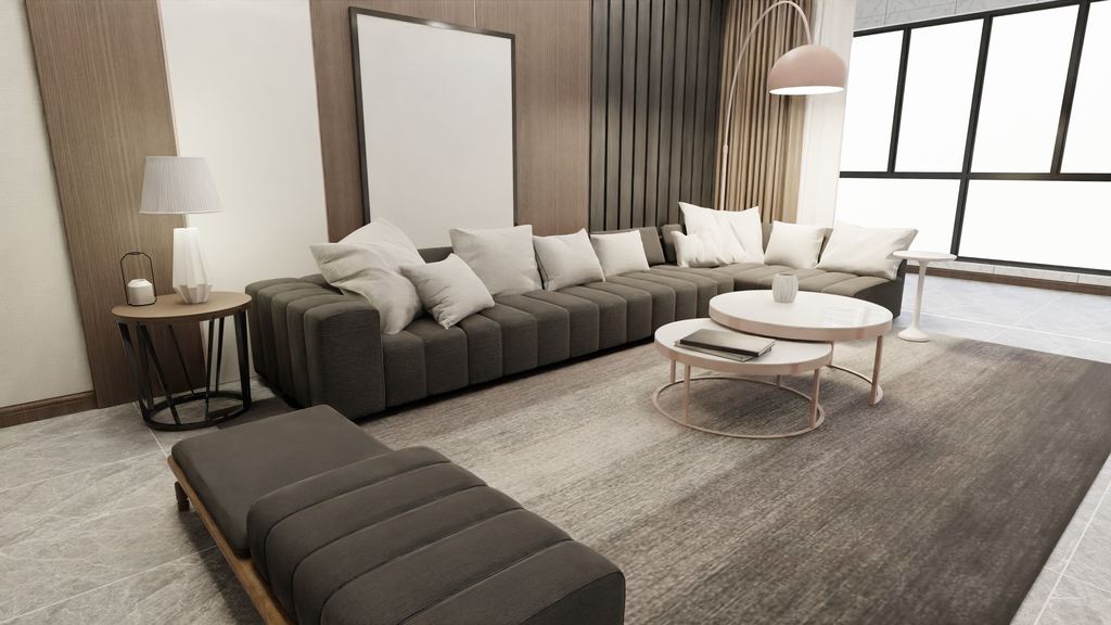 Dark gray bench-style sectional sofa with white pillows and a matching ottoman in a modern living room.