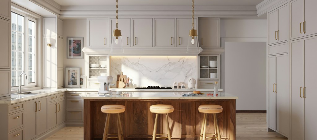 Bright modern kitchen with a wood island and three backless wooden bar stools.