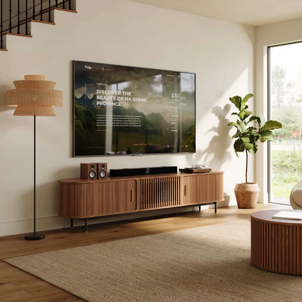Walnut slatted media console beneath a wall-mounted TV in a bright modern living room