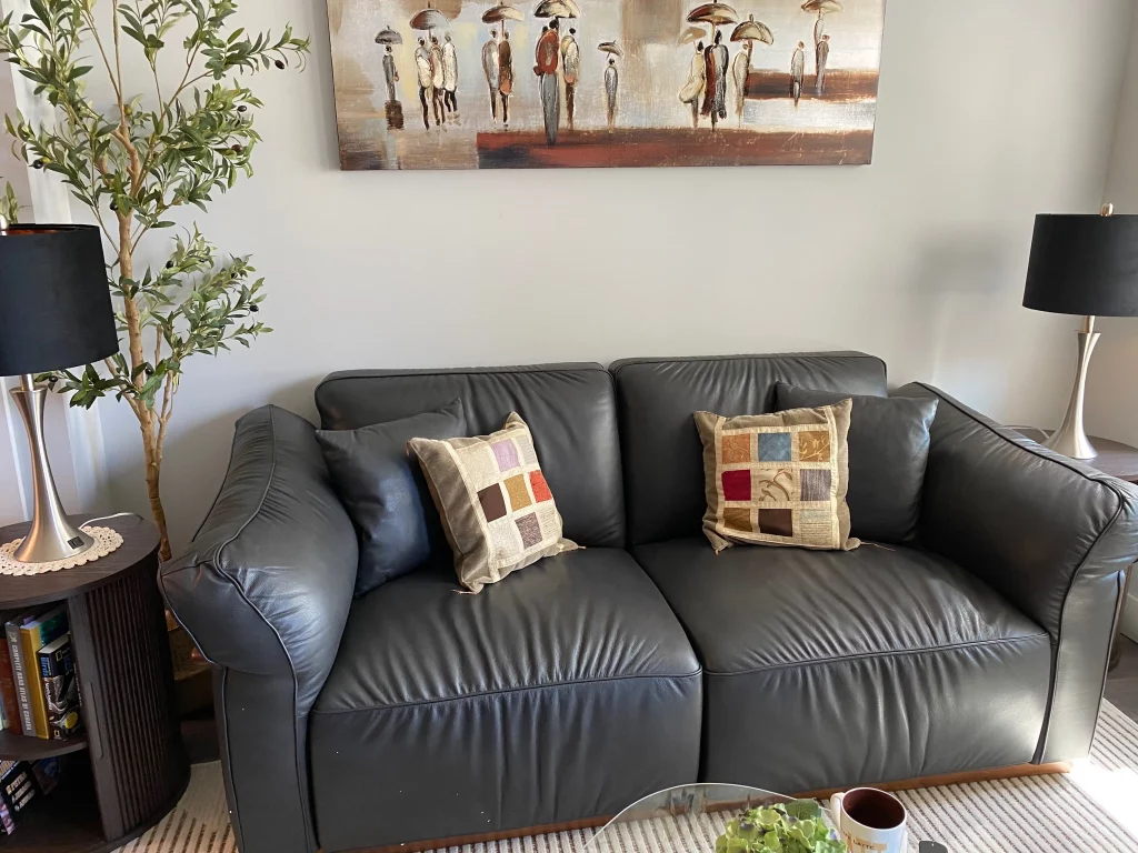Plush leather sofa with deep seating for relaxed lounging and cross-legged sitting