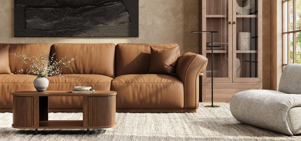 Brown high-arm leather sofa with deep cushions and throw pillows in a warm modern living room.