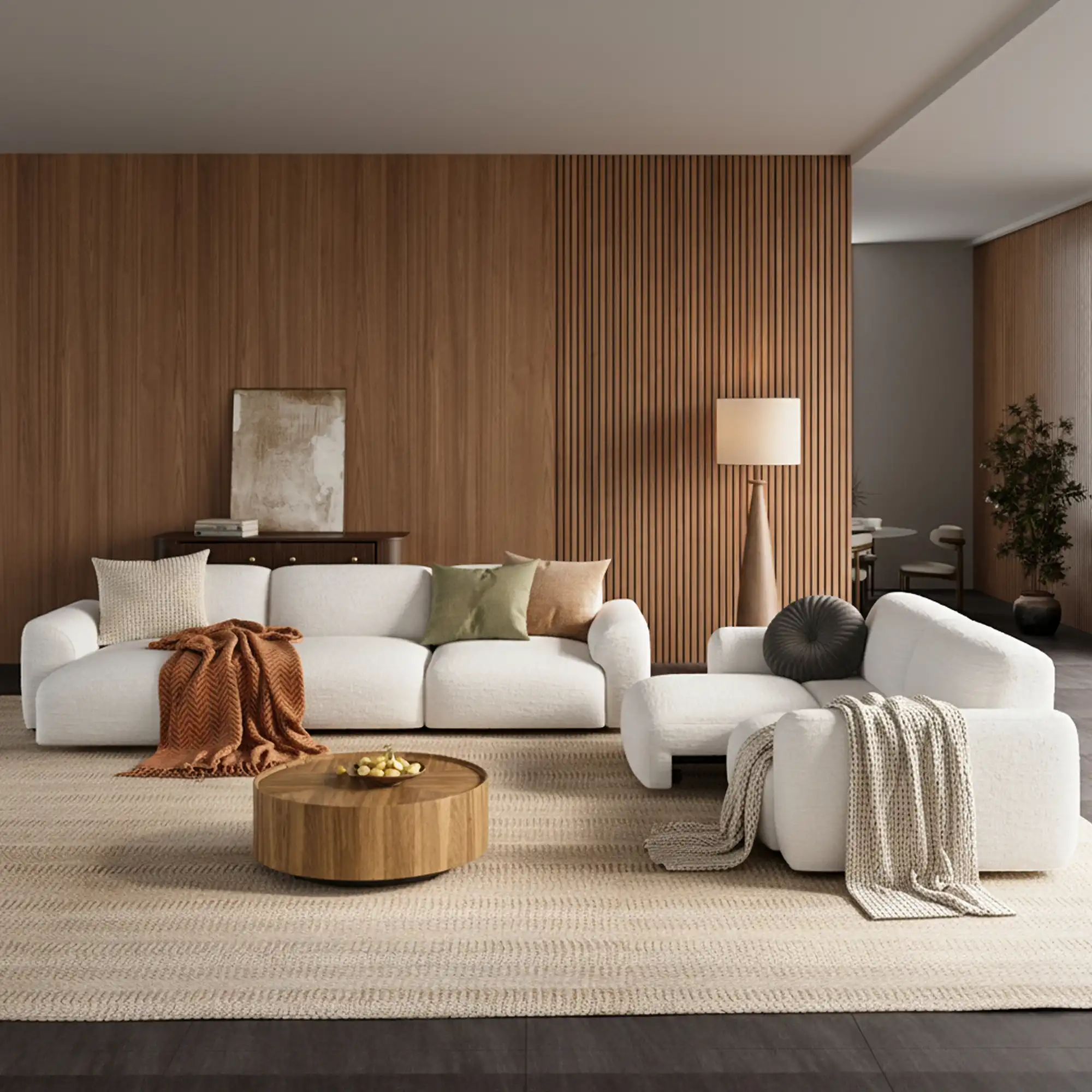 White sofa bed set with an extended lounge section in a warm modern living room