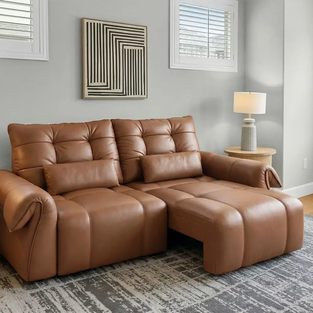 Brown leather reclining sofa with extended footrests and deep cushioned seating