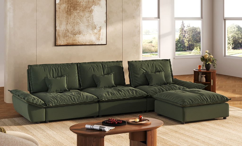 Oversized green sectional sofa with deep seating and a chaise in a modern living room.