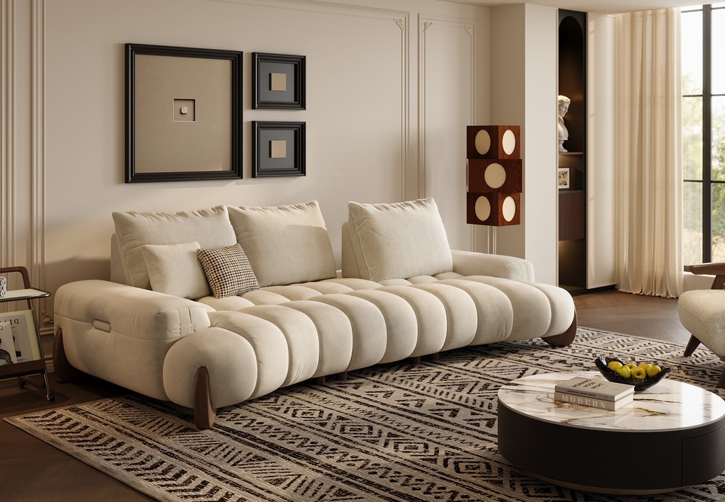 Cream upholstered sofa in a modern living room with dark wood floors, patterned rug, and neutral decor