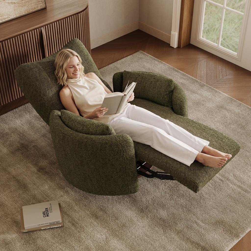 Woman reading in a green recliner extended over a beige rug beside hardwood flooring.