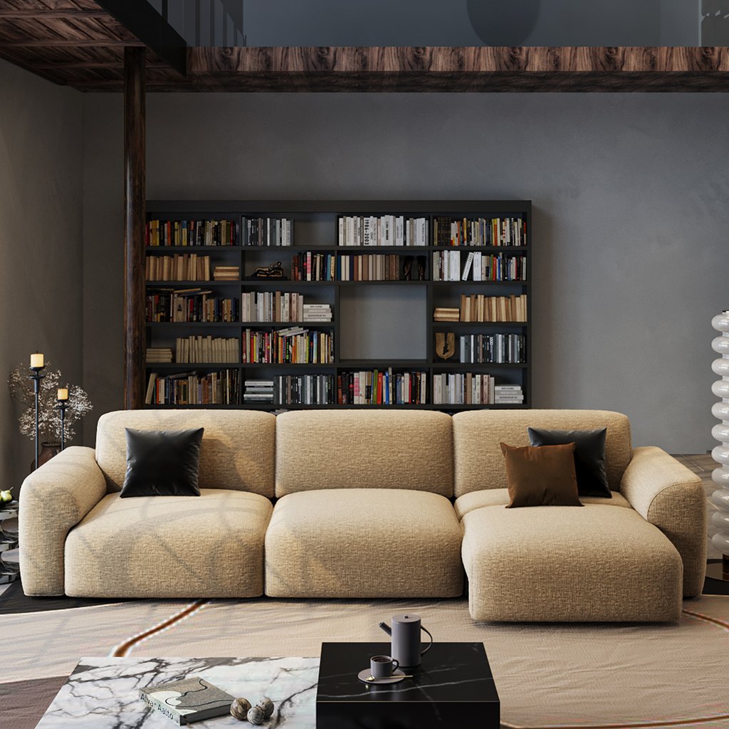Modern living room with a large beige sectional sofa, black bookcase, and marble coffee table.
